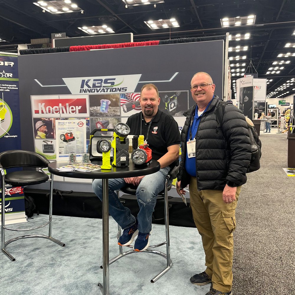 Our Wonderfull Employee Clay, taking a picture with a customer with multiple KBS Innovations Products at the FDIC Trade Show